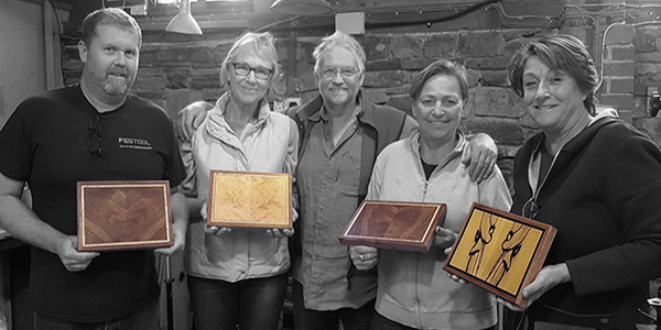 Andrew Crawford [smartBoxmaker, centre] and four students proudly showing their boxes at the end of a smartBoxmaker box making course
